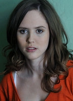 EMILY COX
